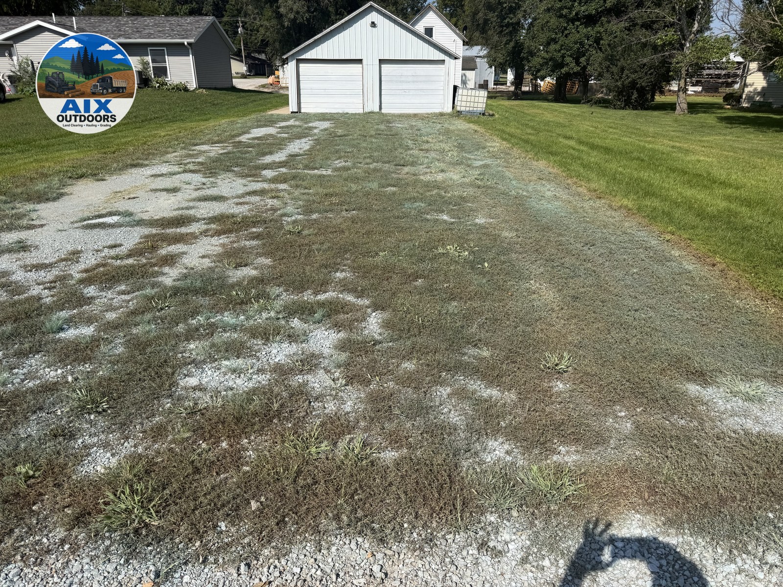 Before — weedy gravel driveway