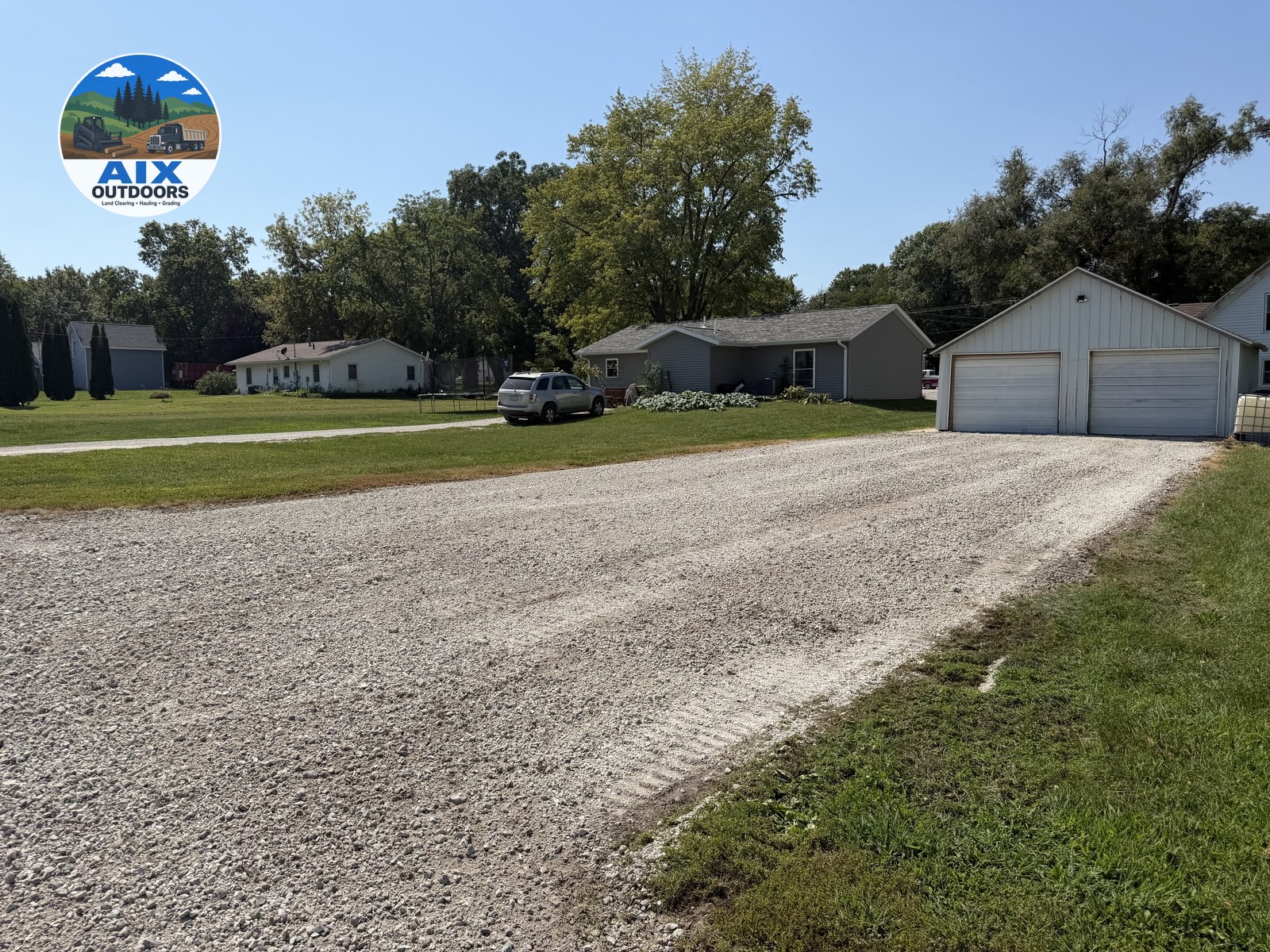 Finished residential pad — AIX Outdoors gravel driveway work